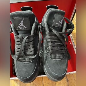 Air Jordan 4 Retro black, 5.5 youth/women’s 7, new in box.